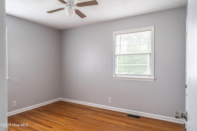 137 Pinecrest Trl, Rockingham, NC 28379 - empty room with baseboards, wood finished floors, and a ceiling fan