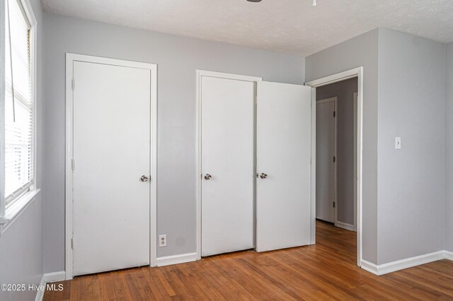 137 Pinecrest Trl, Rockingham, NC 28379 - unfurnished bedroom featuring wood finished floors and baseboards