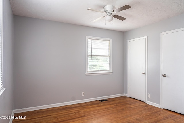 137 Pinecrest Trl, Rockingham, NC 28379 - spare room with wood finished floors, ceiling fan, and baseboards