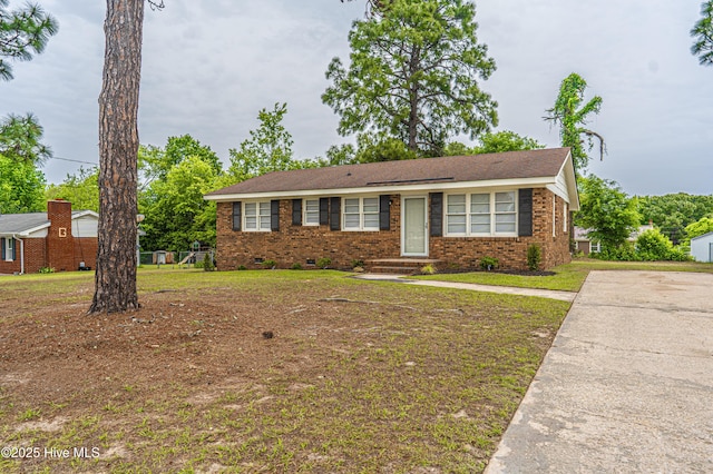 137 Pinecrest Trl, Rockingham, NC 28379 - ranch-style home featuring brick siding, a front lawn, and crawl space