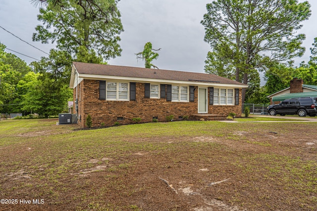 137 Pinecrest Trl, Rockingham, NC 28379 - view of front of property featuring crawl space, a front yard, brick siding, and central AC unit