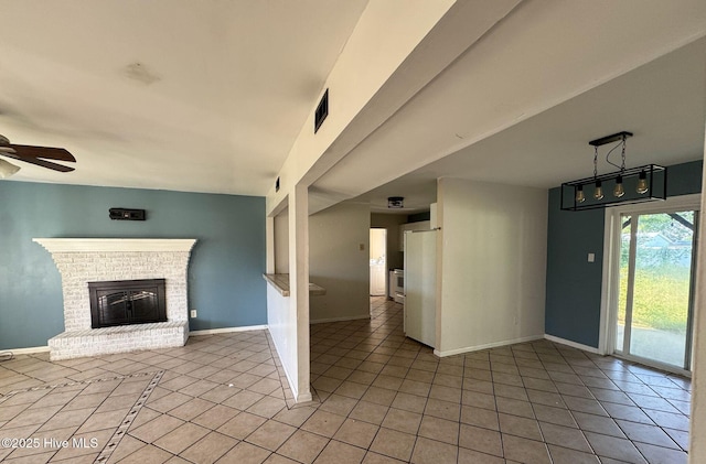 7 Walnut Dr, Jacksonville, NC 28546 - unfurnished living room with a ceiling fan, light tile patterned floors, baseboards, and a brick fireplace