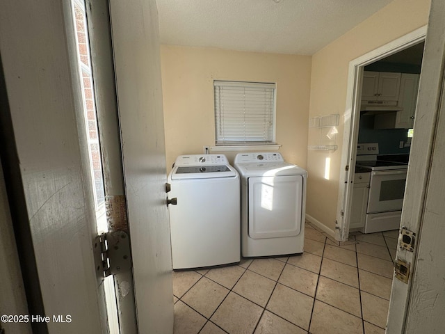 7 Walnut Dr, Jacksonville, NC 28546 - laundry room with separate washer and dryer, light tile patterned flooring, and healthy amount of natural light