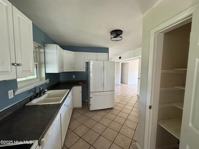 7 Walnut Dr, Jacksonville, NC 28546 - kitchen featuring white appliances, a sink, dark countertops, and white cabinets