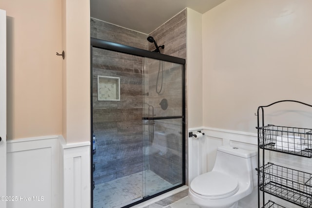 338 Country Club Rd, Camden, NC 27921 - full bathroom featuring a wainscoted wall, a stall shower, toilet, and a decorative wall