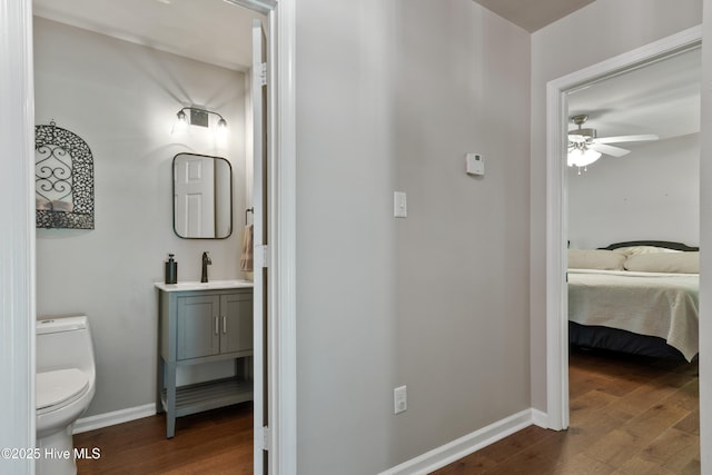 338 Country Club Rd, Camden, NC 27921 - ensuite bathroom with wood finished floors, a ceiling fan, toilet, and baseboards