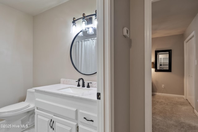338 Country Club Rd, Camden, NC 27921 - bathroom with toilet, vanity, and baseboards