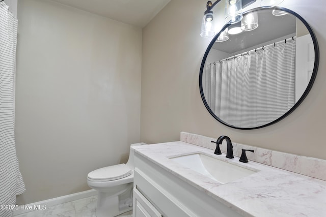 338 Country Club Rd, Camden, NC 27921 - full bath featuring marble look tile flooring, toilet, vanity, and baseboards