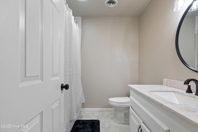 338 Country Club Rd, Camden, NC 27921 - bathroom with marble finish floors, vanity, toilet, and baseboards