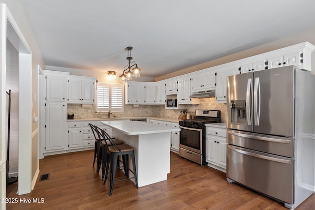 338 Country Club Rd, Camden, NC 27921 - kitchen featuring stainless steel appliances, a sink, light countertops, white cabinetry, and tasteful backsplash