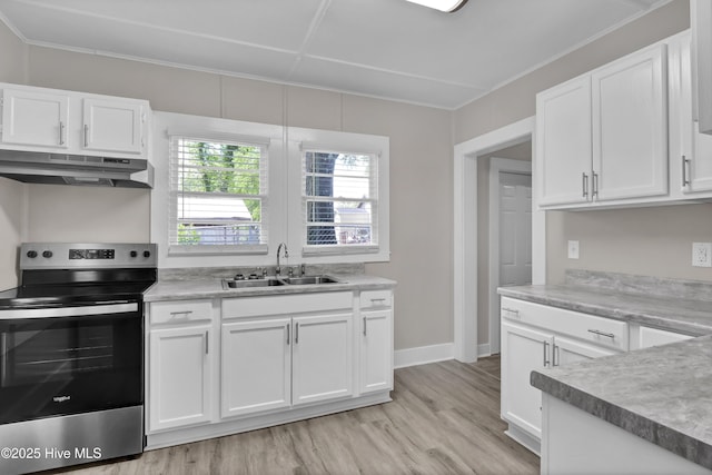 kitchen with stainless steel range with electric cooktop, a sink, under cabinet range hood, light wood-style flooring, and white cabinetry