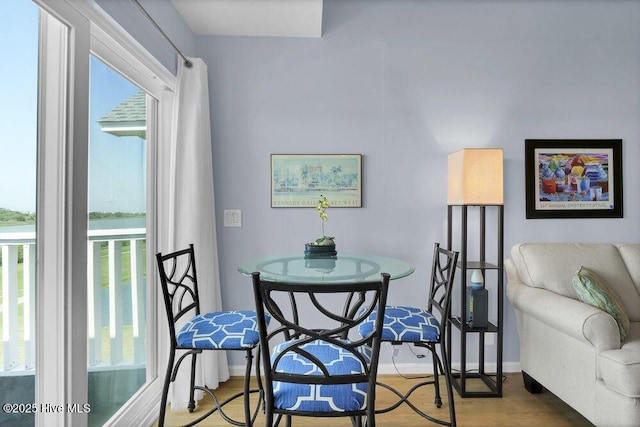 1912 Goose Creek Rd SW Unit 4302, Ocean Isle Beach, NC 28469 - dining room with healthy amount of natural light, wood finished floors, and baseboards