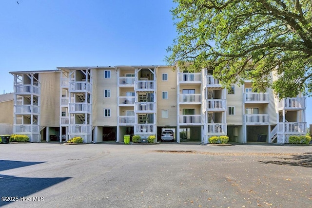 1912 Goose Creek Rd SW Unit 4302, Ocean Isle Beach, NC 28469 - view of apartment building / complex with uncovered parking
