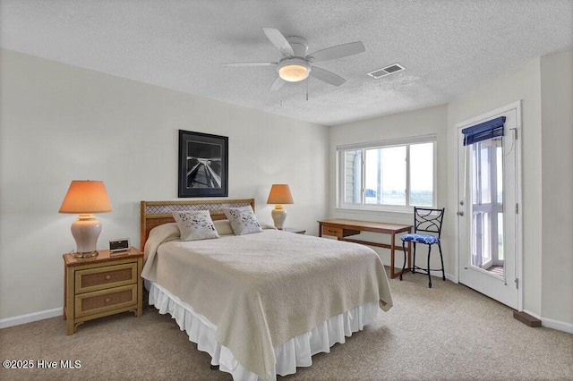 1912 Goose Creek Rd SW Unit 4302, Ocean Isle Beach, NC 28469 - carpeted bedroom with baseboards, a textured ceiling, ceiling fan, and access to exterior