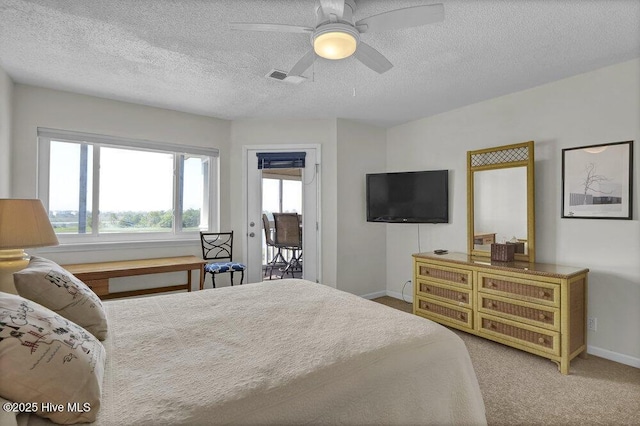 1912 Goose Creek Rd SW Unit 4302, Ocean Isle Beach, NC 28469 - bedroom featuring a textured ceiling, baseboards, carpet floors, a ceiling fan, and access to outside