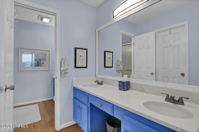 1912 Goose Creek Rd SW Unit 4302, Ocean Isle Beach, NC 28469 - bathroom with wood finished floors, double vanity, baseboards, and a shower