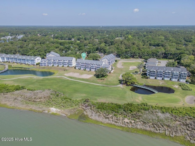 1912 Goose Creek Rd SW Unit 4302, Ocean Isle Beach, NC 28469 - drone / aerial view of a local golf course, a nearby body of water, a forest, and apartment complex