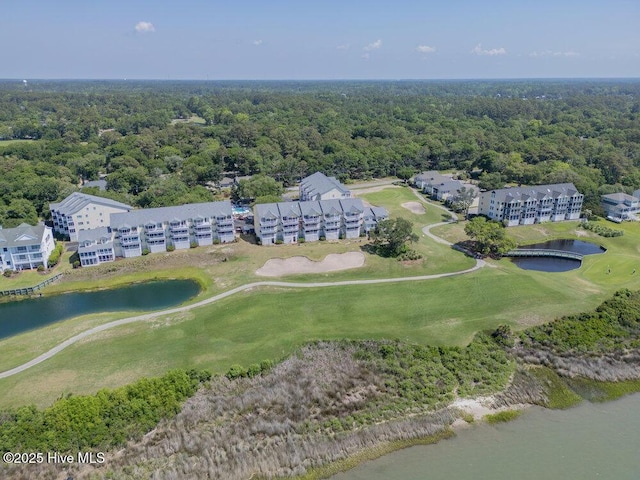 1912 Goose Creek Rd SW Unit 4302, Ocean Isle Beach, NC 28469 - drone / aerial view of a large body of water, apartment complex, a golf club, and a heavily wooded area