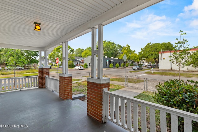 view of patio with covered porch and a residential view
