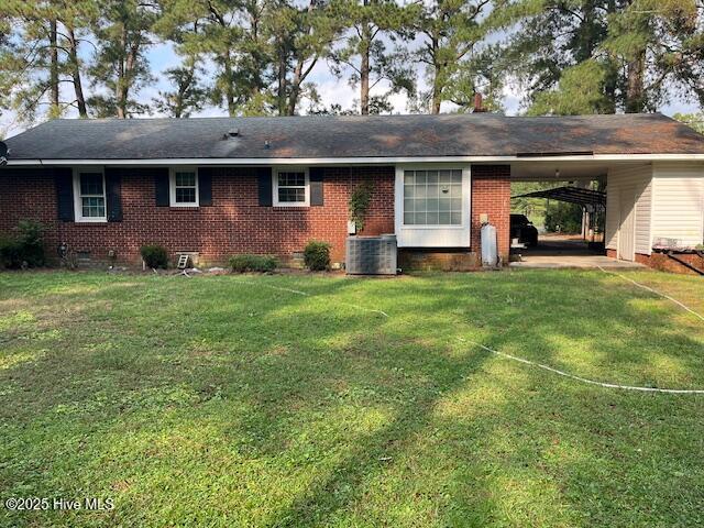 1616 Hwy 58 S, Snow Hill, NC 28580 - back of property with crawl space, an attached carport, brick siding, a yard, and central air condition unit