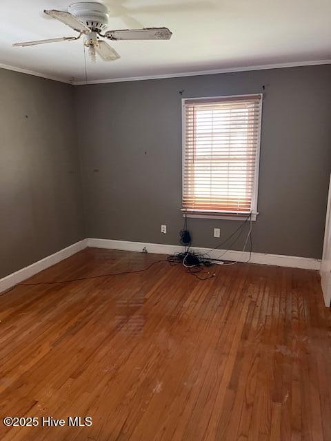 1616 Hwy 58 S, Snow Hill, NC 28580 - empty room featuring crown molding, wood finished floors, baseboards, and a ceiling fan