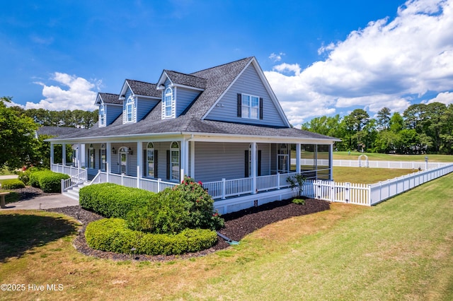 view of front facade with covered porch and a shingled roof