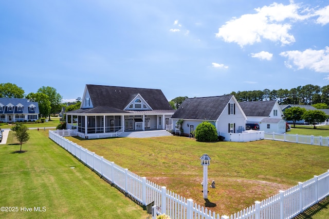 rear view of house featuring a sunroom