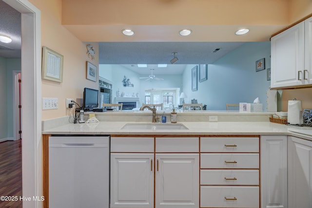 6025 Inland Greens Dr, Wilmington, NC 28405 - kitchen with dishwasher, a sink, a ceiling fan, white cabinetry, and recessed lighting