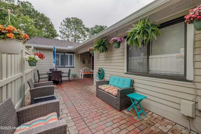 6025 Inland Greens Dr, Wilmington, NC 28405 - view of patio / terrace featuring outdoor dining area and fence