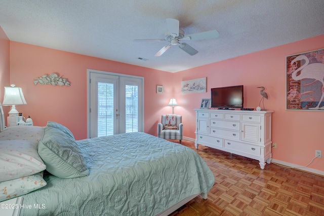 6025 Inland Greens Dr, Wilmington, NC 28405 - bedroom with baseboards, access to outside, a textured ceiling, and ceiling fan