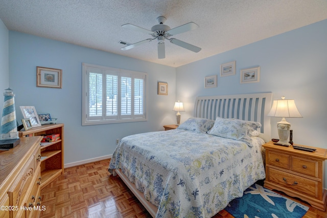 6025 Inland Greens Dr, Wilmington, NC 28405 - bedroom featuring baseboards, a textured ceiling, and a ceiling fan