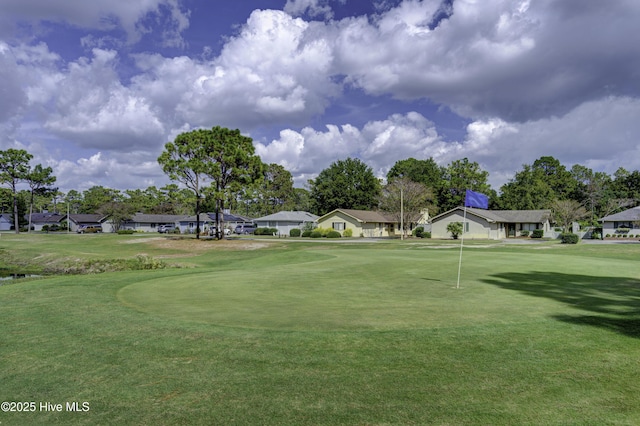 6025 Inland Greens Dr, Wilmington, NC 28405 - view of home's community featuring a residential view, a yard, an area to practice putting, and golf course view
