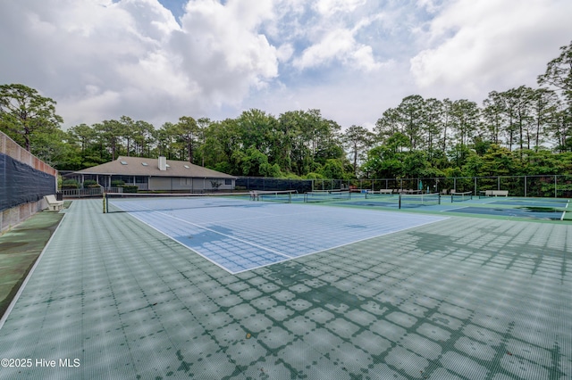 6025 Inland Greens Dr, Wilmington, NC 28405 - view of tennis court with fence and view of wooded area