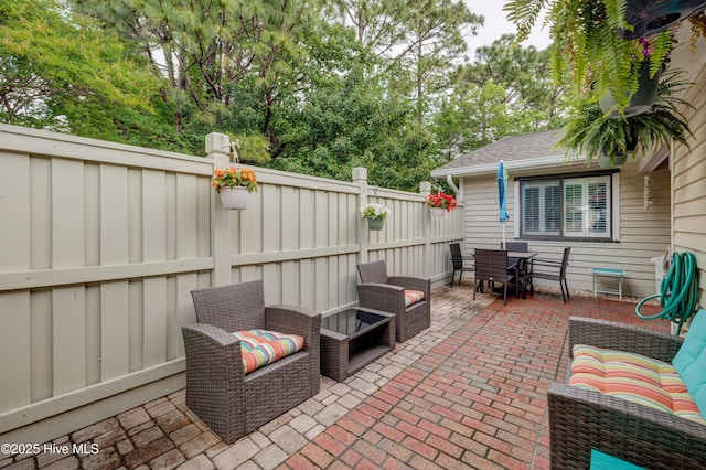 6025 Inland Greens Dr, Wilmington, NC 28405 - view of patio / terrace with a fenced backyard and outdoor dining area