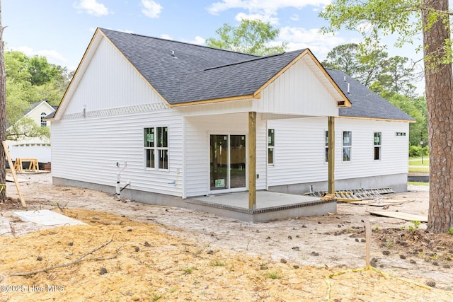 3122 Oak Dr SW, Shallotte, NC 28470 - rear view of house featuring roof with shingles and a patio