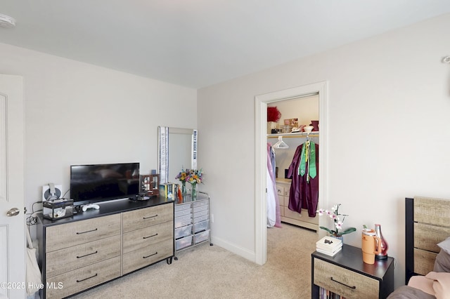 living area with light colored carpet and baseboards