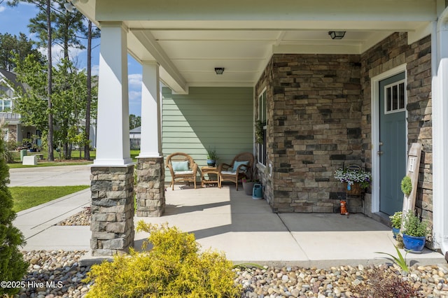 view of patio featuring a porch