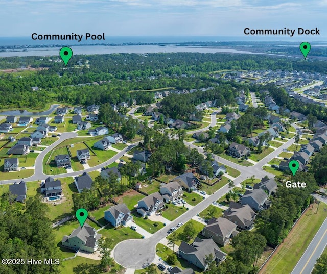 aerial overview of property's location with a large body of water and nearby suburban area