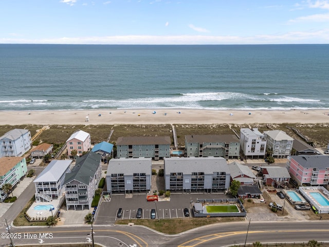 aerial view of waterfront with a beach