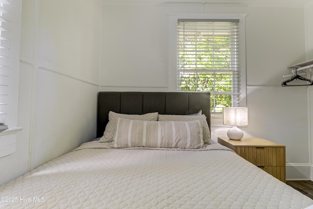 bedroom with wood finished floors