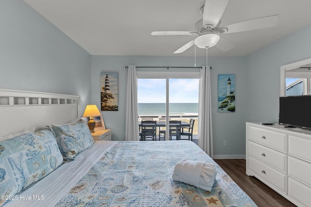 608 Carolina Beach Ave N Unit 3C, Carolina Beach, NC 28428 - bedroom featuring access to exterior, dark wood-style floors, multiple windows, and baseboards