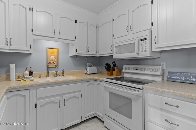 608 Carolina Beach Ave N Unit 3C, Carolina Beach, NC 28428 - kitchen featuring white appliances, a sink, light countertops, white cabinetry, and ornamental molding