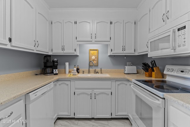 608 Carolina Beach Ave N Unit 3C, Carolina Beach, NC 28428 - kitchen featuring white appliances, a sink, light countertops, white cabinetry, and ornamental molding