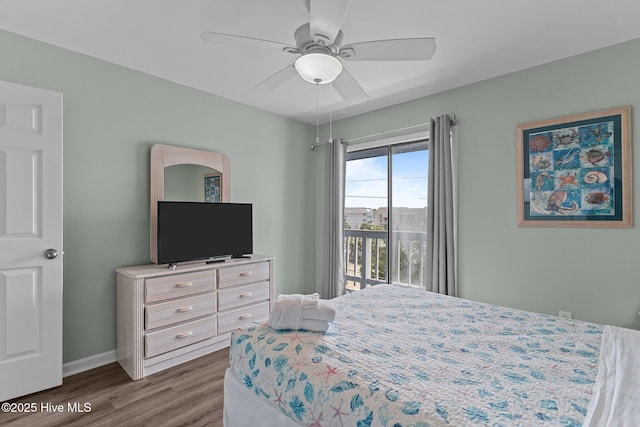 608 Carolina Beach Ave N Unit 3C, Carolina Beach, NC 28428 - bedroom with dark wood-style floors, access to exterior, baseboards, and a ceiling fan