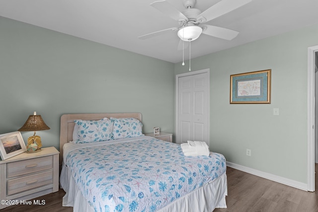 608 Carolina Beach Ave N Unit 3C, Carolina Beach, NC 28428 - bedroom featuring wood finished floors, baseboards, and a ceiling fan