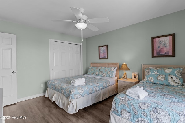 608 Carolina Beach Ave N Unit 3C, Carolina Beach, NC 28428 - bedroom featuring wood finished floors, a closet, baseboards, and a ceiling fan