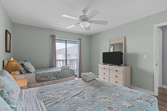 608 Carolina Beach Ave N Unit 3C, Carolina Beach, NC 28428 - bedroom featuring access to exterior, wood finished floors, baseboards, and ceiling fan