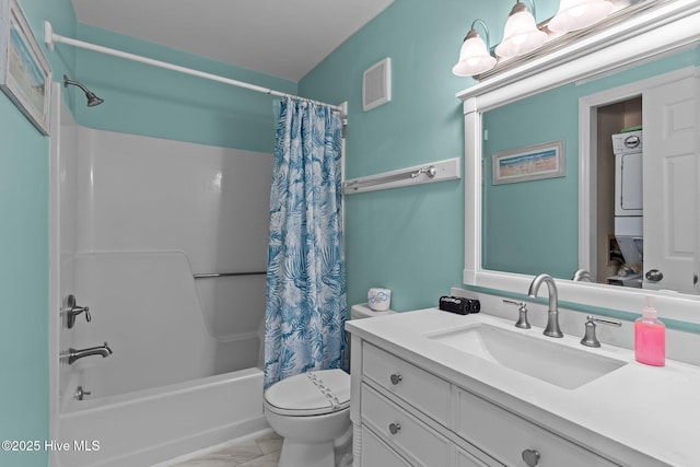 608 Carolina Beach Ave N Unit 3C, Carolina Beach, NC 28428 - full bathroom featuring estacked washer and dryer, shower / bath combo with shower curtain, toilet, and vanity