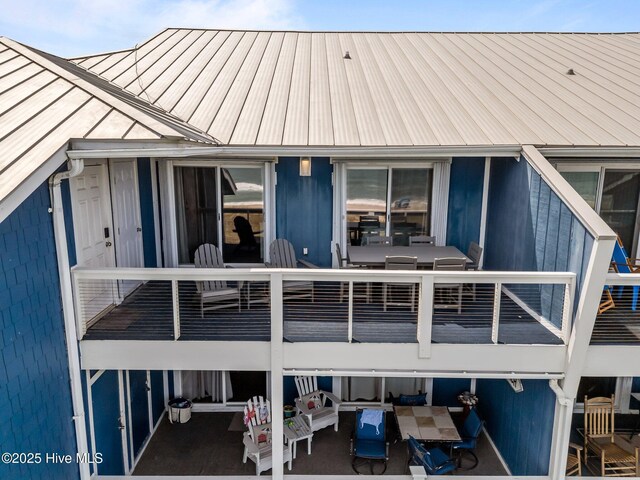 608 Carolina Beach Ave N Unit 3C, Carolina Beach, NC 28428 - back of house featuring an outdoor hangout area, metal roof, and a balcony