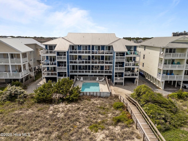 608 Carolina Beach Ave N Unit 3C, Carolina Beach, NC 28428 - back of property featuring metal roof